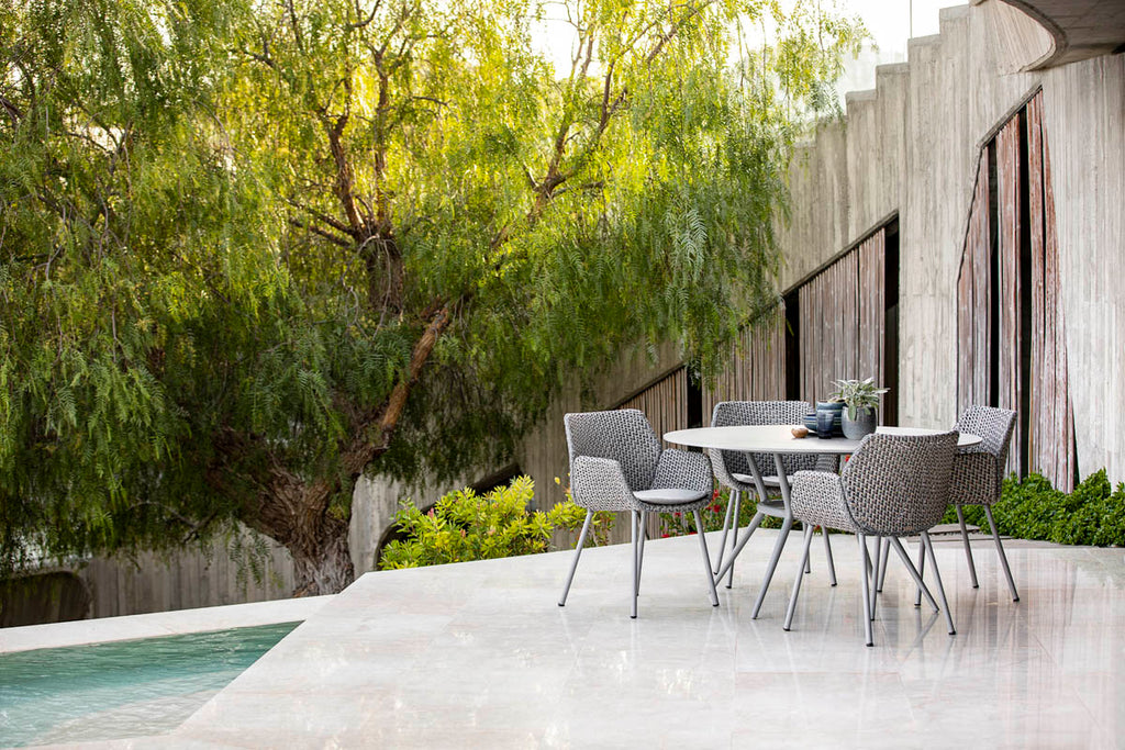 Modern outdoor dining chair with an elegant dining table