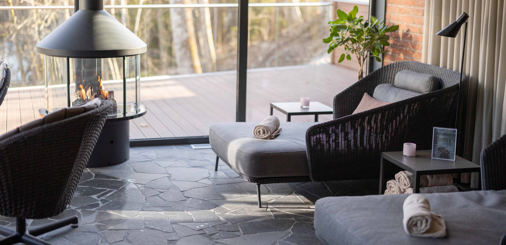 Swedish Hestraviken spa lounge area with Cane-line Mega daybed and Peacock lounge  