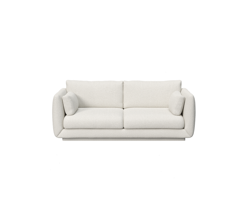Hvit moderne minimalistisk sofa med avrundede armlener og myke puter.