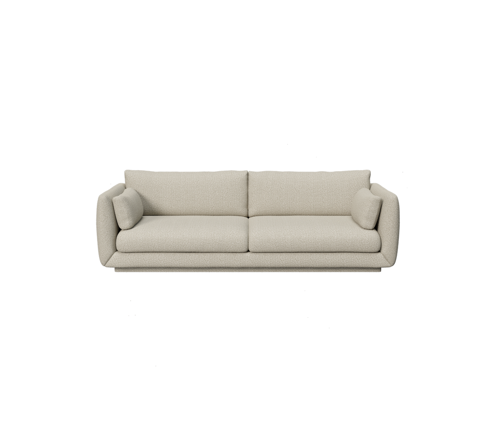 Lysbrun moderne sofa med avrundede kanter og puter.