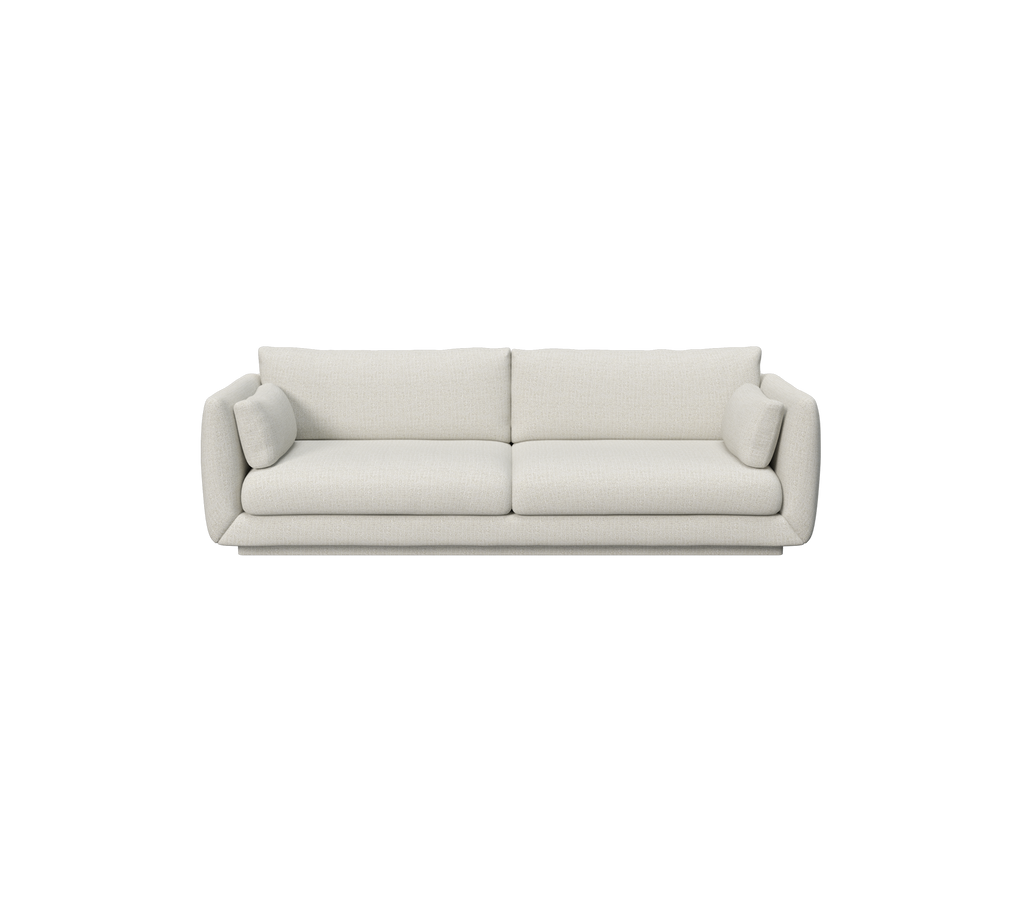 Moderne sandfarget sofa med myke puter og et minimalistisk design.