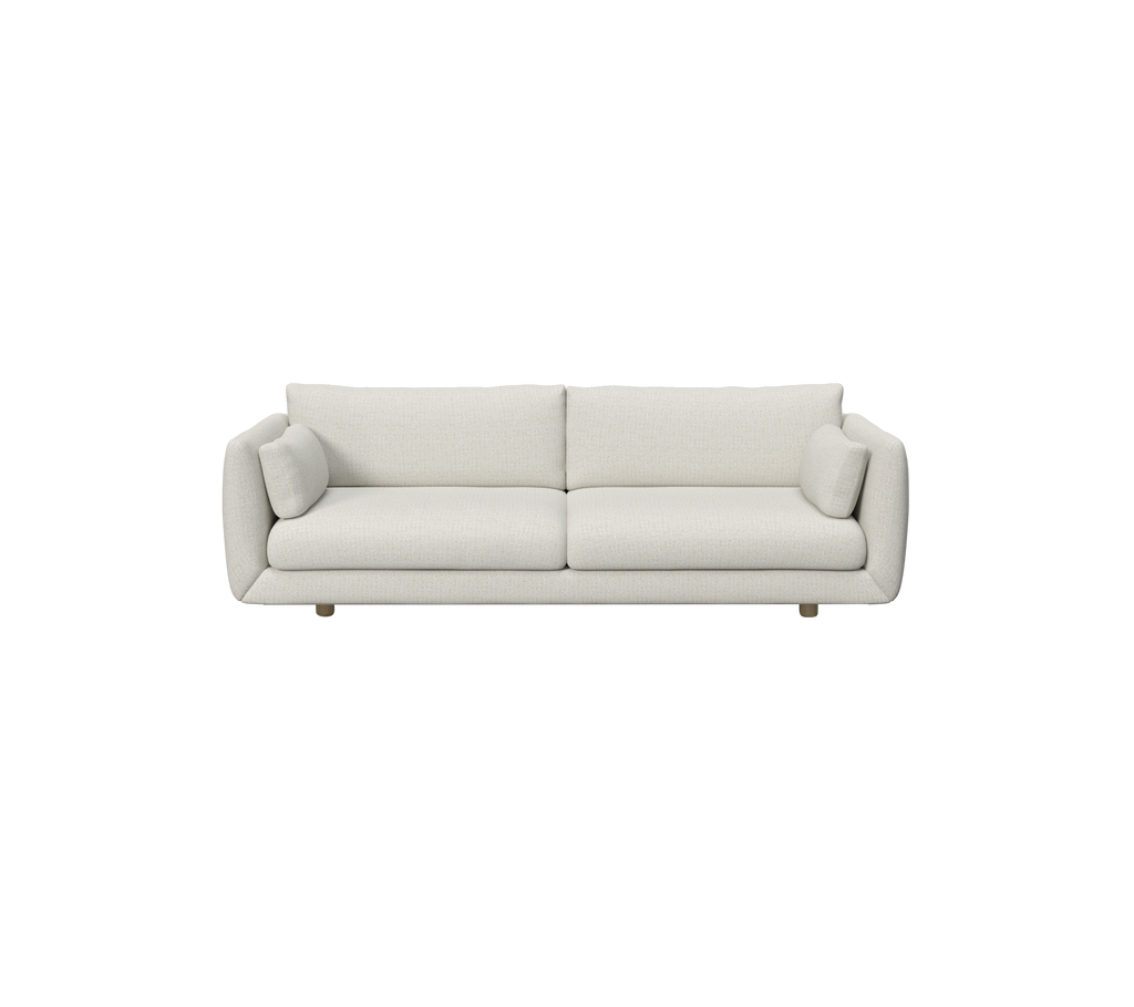 Moderne sandfarget sofa med runde puter.