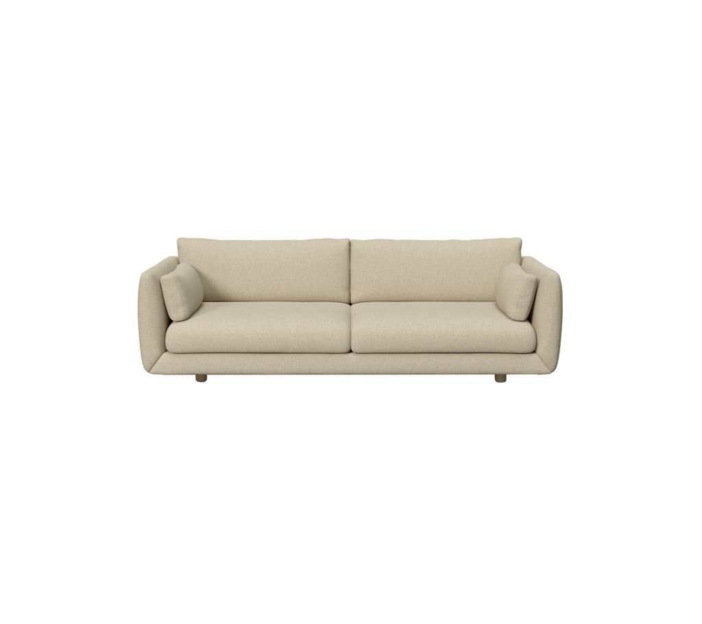 Lys brun moderne sofa med runde puter.
