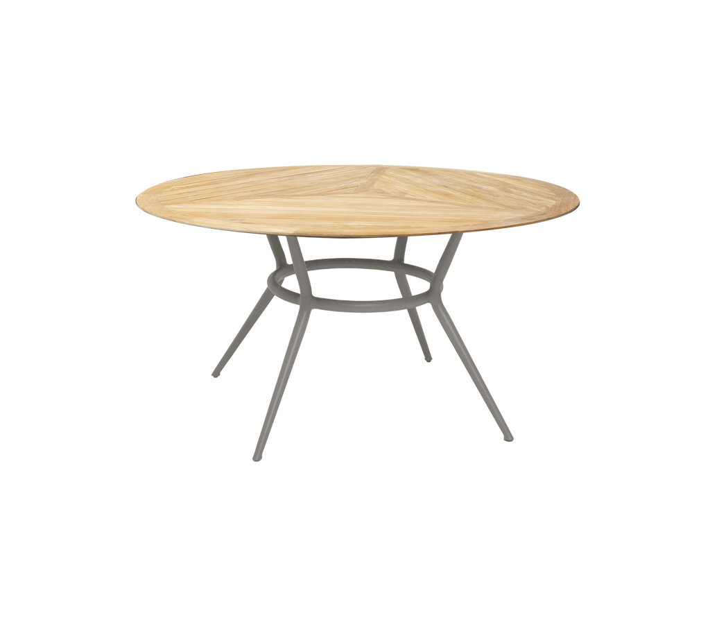 Taupe rundt bord med et enkelt design og slanke ben.