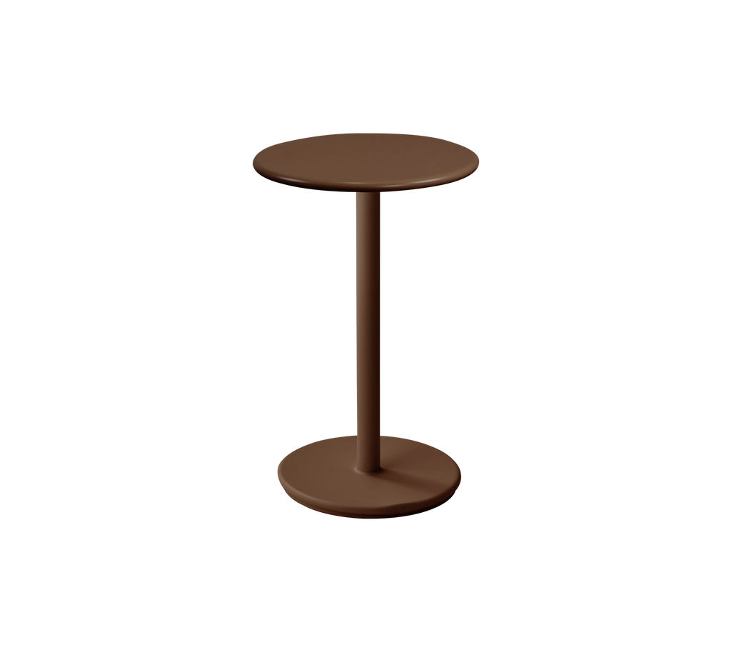 Moderne rundt bord i ørkenrød farge.