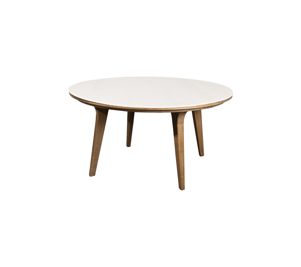 Rundt bord med en glatt hvit topp og treben, ideelt for middag eller uformelle sammenkomster. Elegant og moderne design.