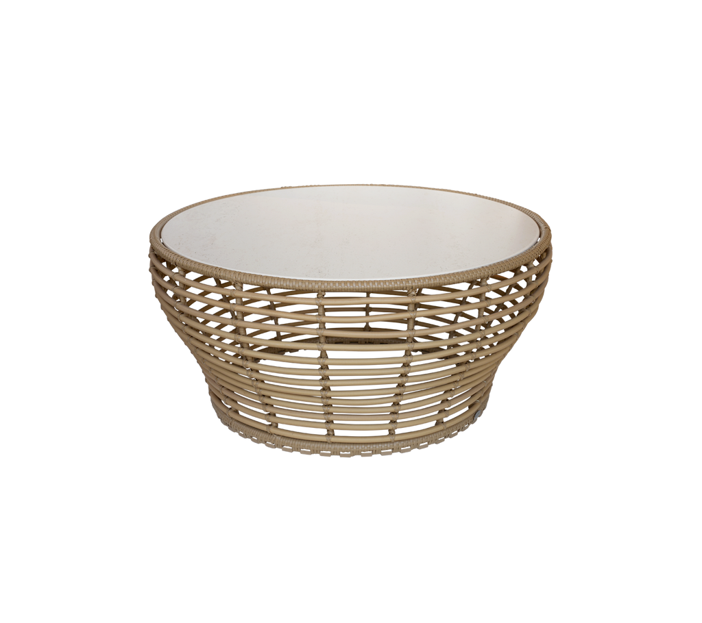 Stilig rund kurv med et naturlig vevd design og en hvit innside, perfekt for oppbevaring av gjenstander eller som et dekorativt element.