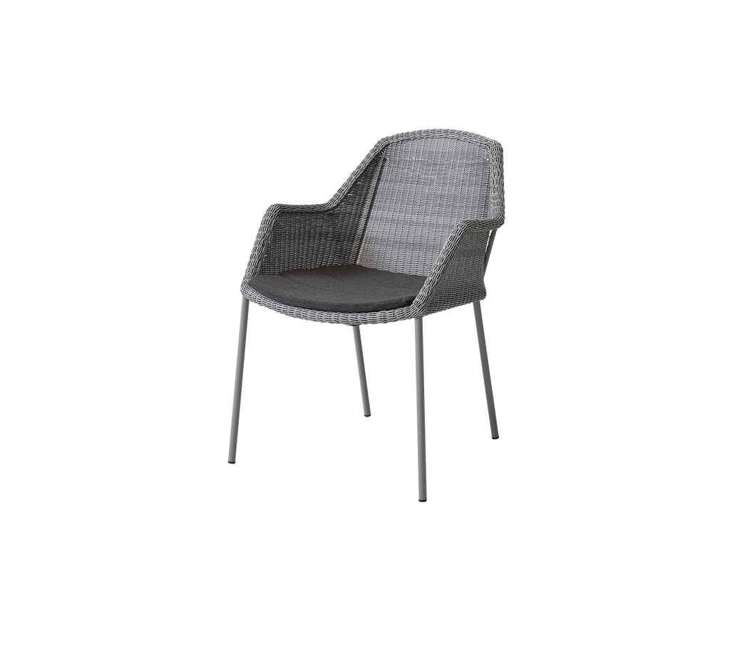 Stylish woven chair with a comfortable seat and armrests, featuring a sleek design and sturdy legs, perfect for modern spaces.