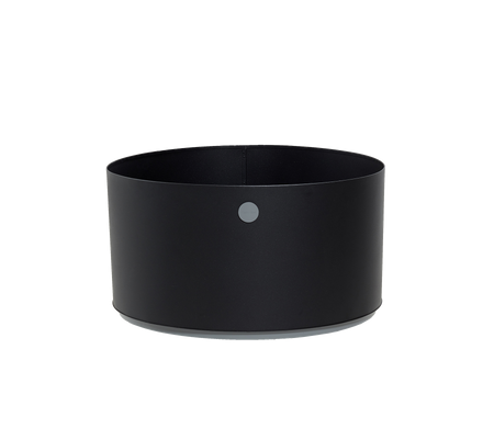 Rund svart beholder med minimalistisk design og en liten grå prikk som aksent. Perfekt for variert lagring og organisering.