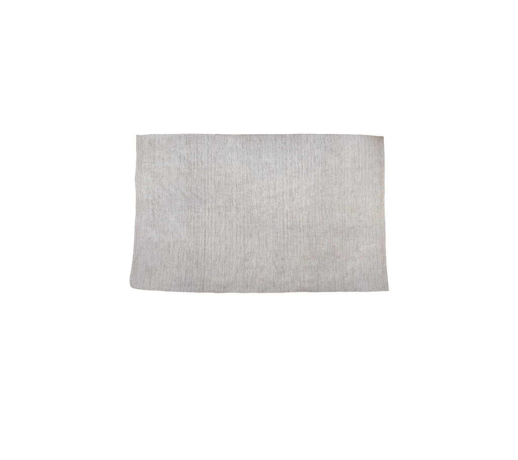 Sand flerfarget produkt vist på en ensfarget bakgrunn.