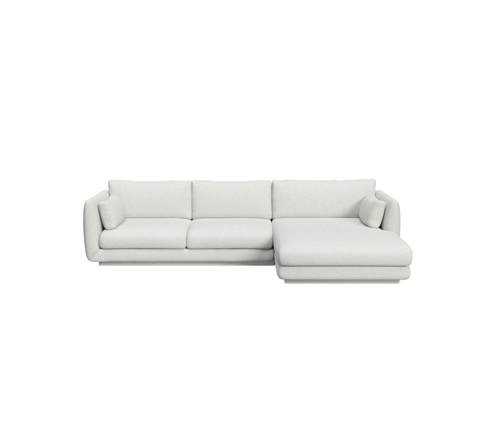 Lys grå moderne sofa med minimalistisk design.