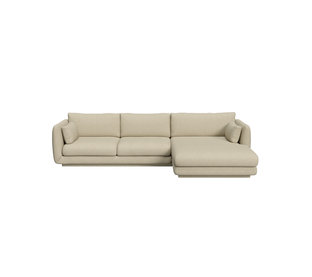 Lys brun seksjonalsofa i en moderne stueinnredning.