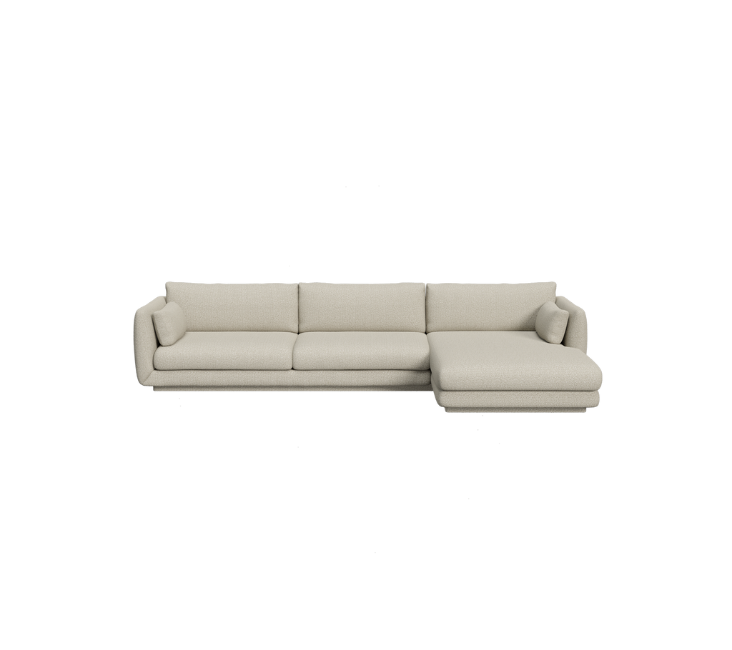 Lysebrunt seksjonelt sofa i en moderne loungeinnstilling.