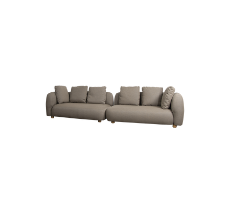 Moderne L-formet sofa i en nøytral tone, med myke puter og avrundede armlener, ideell for komfortabel sitting.